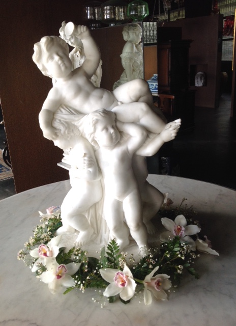 White Marble, Modeled as four Bacchic Putti
